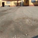 Parking Area prior to Durasolution Application Parking Area in need of a dust control solution