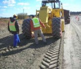 Mixing of the EBS and Soil to bring to OMC gravel access road stabilization